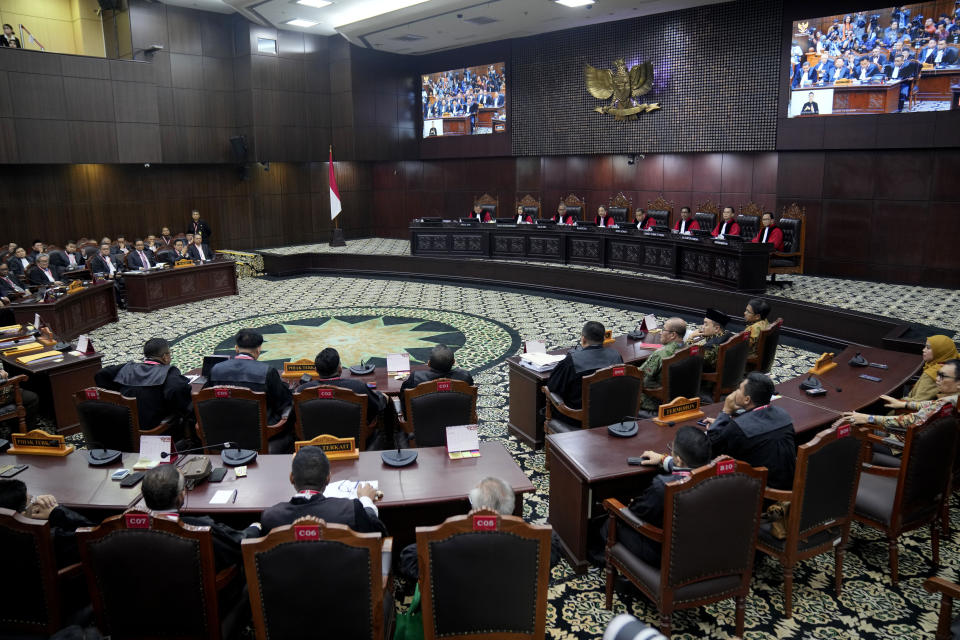 Judges preside over the election appeal hearing at the Constitutional Court in Jakarta, Indonesia, Monday, April 22, 2024. The country's top court on Monday rejected appeals lodged by two losing presidential candidates who are demanding a revote, alleging widespread irregularities and fraud at the February polls. (AP Photo/Dita Alangkara)