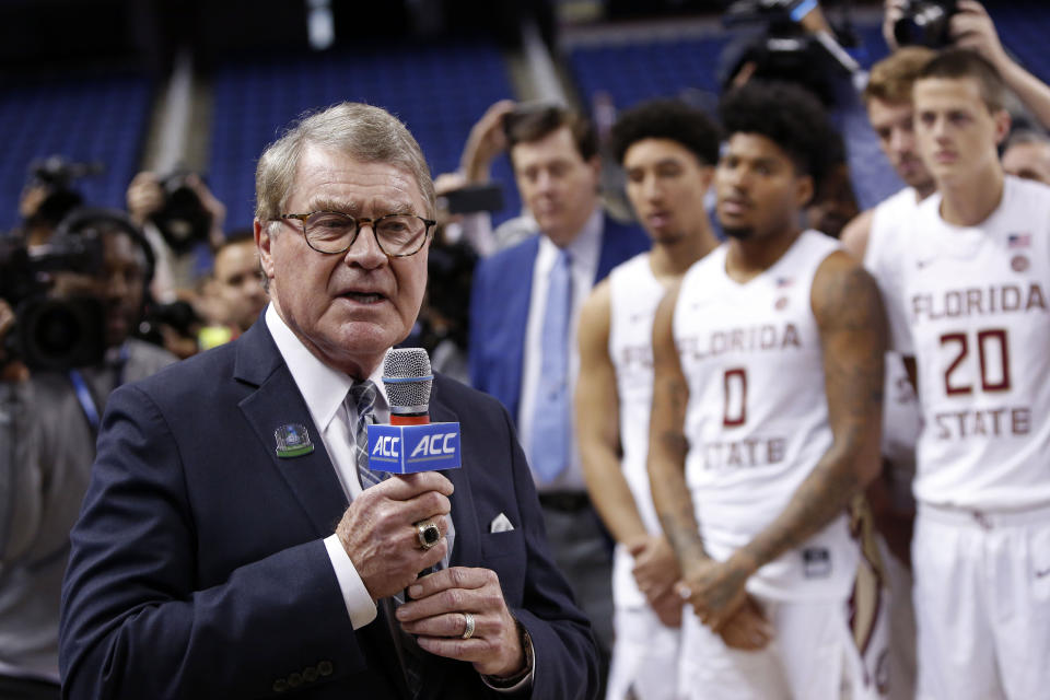 FILE - In this March 12, 2020, file photo, John Swofford, commissioner of the Atlantic Coast Conference, announces the cancellation of NCAA college basketball games at the ACC tournament in Greensboro, N.C. The Power Five conferences spent $350,000 on lobbying in the first three months of 2020, more than they had previously spent in any full year, as part of a coordinated effort to influence Congress on legislation affecting the ability of college athletes to earn endorsement money. “In this particular case, the (Power Five) conferences are working together on this so that there’s less confusion, not more, in terms of the messaging to congressional leaders that helps explain NIL (Names, Images and Likenesses) and what the concerns are, and how it might work,” Swofford told The Associated Press. (AP Photo/Ben McKeown, File)