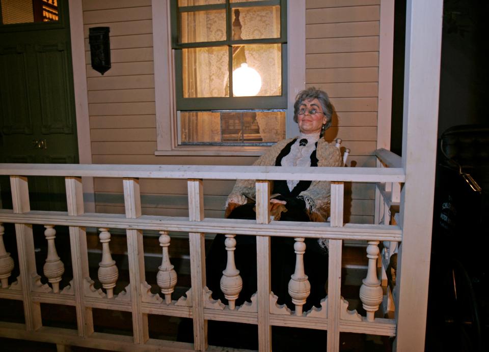 Granny rocks on her front porch in the Milwaukee Public Museum's Streets of Old Milwaukee exhibit.