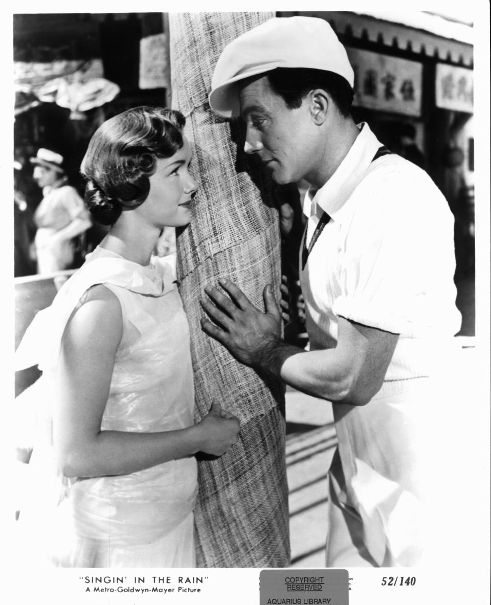 Debbie Reynolds looks at Gene Kelly in a scene from the film 'Singin' In The Rain'