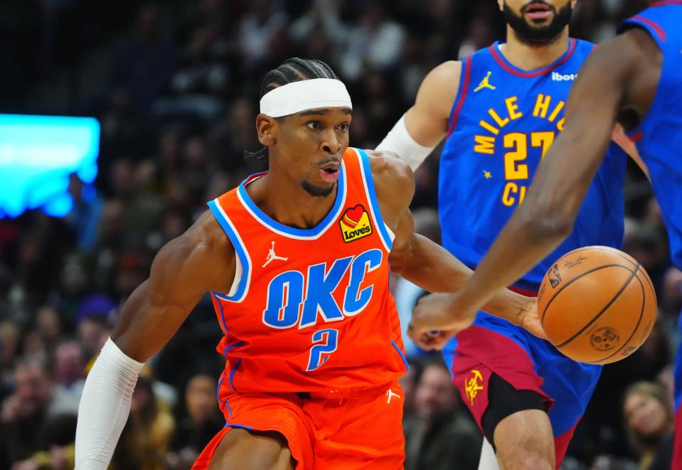 Dec 16, 2023; Denver, Colorado, USA; Oklahoma City Thunder guard Shai Gilgeous-Alexander (2) controls the ball against the Denver Nuggets during the first quarter at Ball Arena. Mandatory Credit: Ron Chenoy-USA TODAY Sports