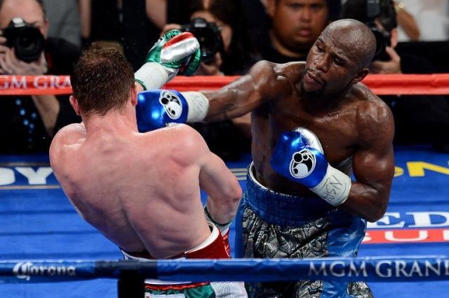 Mayweather wins majority decision vs. Alvarez