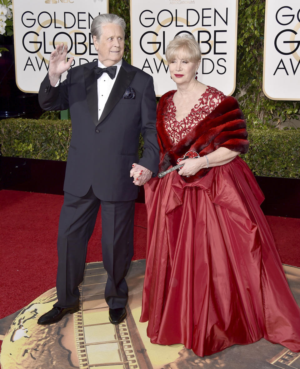 FILE - Brian Wilson, left, and Melinda Ledbetter arrive at the 73rd annual Golden Globe Awards in Beverly Hills, Calif., on Jan. 10, 2016. Ledbetter Wilson, the longtime wife and manager of Brian Wilson whom the Beach Boys co-founder often credited for stabilizing his famously troubled life, has died at age 77. (Photo by Jordan Strauss/Invision/AP, File)