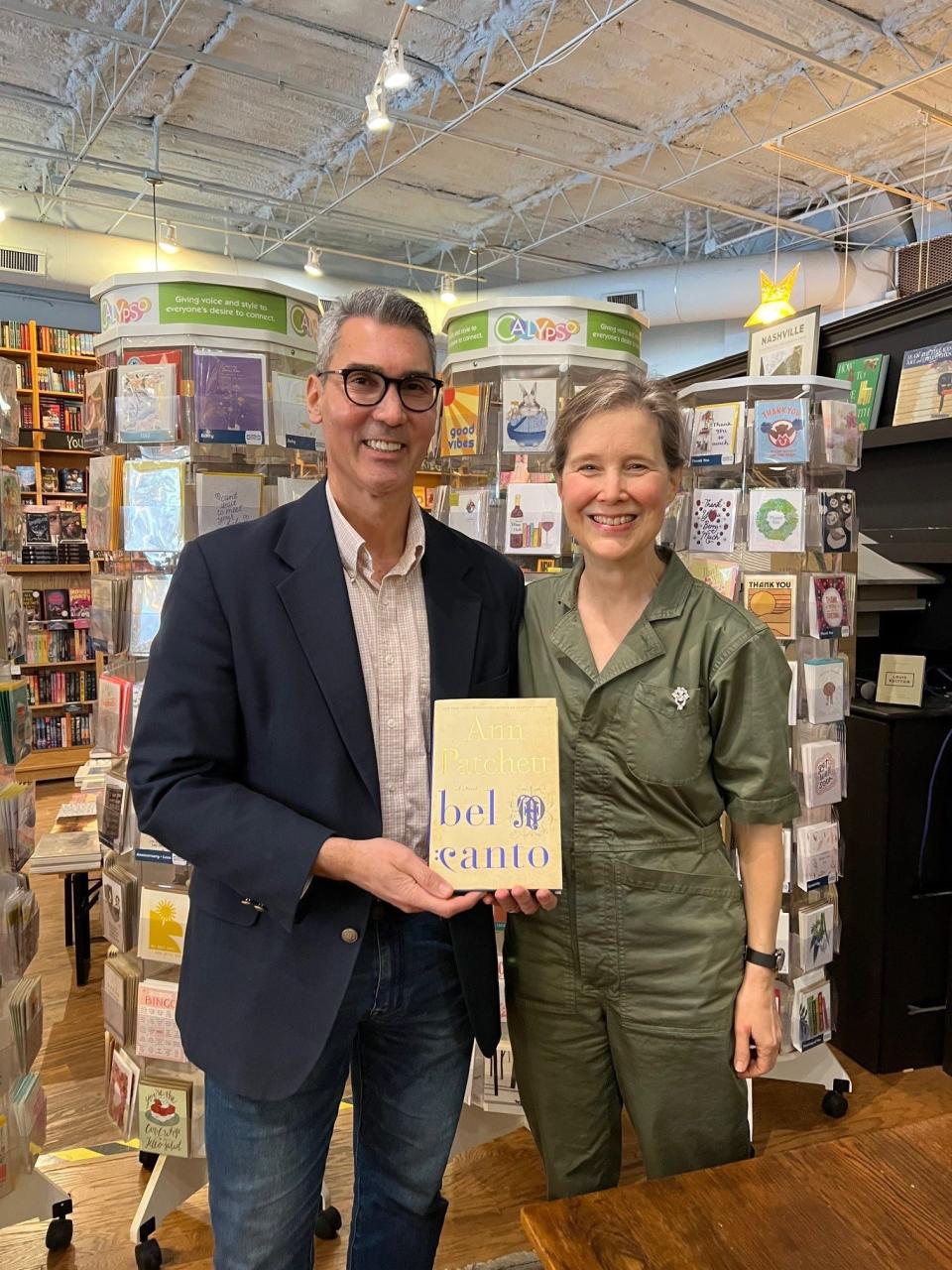 The Tennessean Opinion and Engagement Director David Plazas, left, and Parnassus Books proprietor and novelist Ann Patchett who signed her book "bel canto" for him during her office hours.