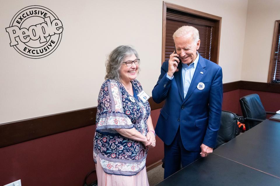 Biden calls a friend of Catherine Crist to say hellow before the Passport to Victory in Central City, Iowa, on Aug. 10, 2019.