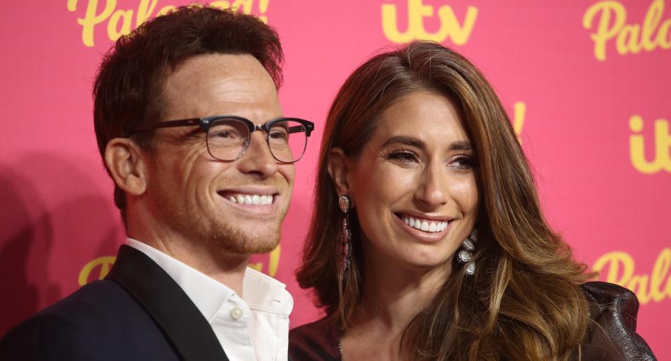 Joe Swash and Stacey Solomon pose on a red carpet. (Getty Images)