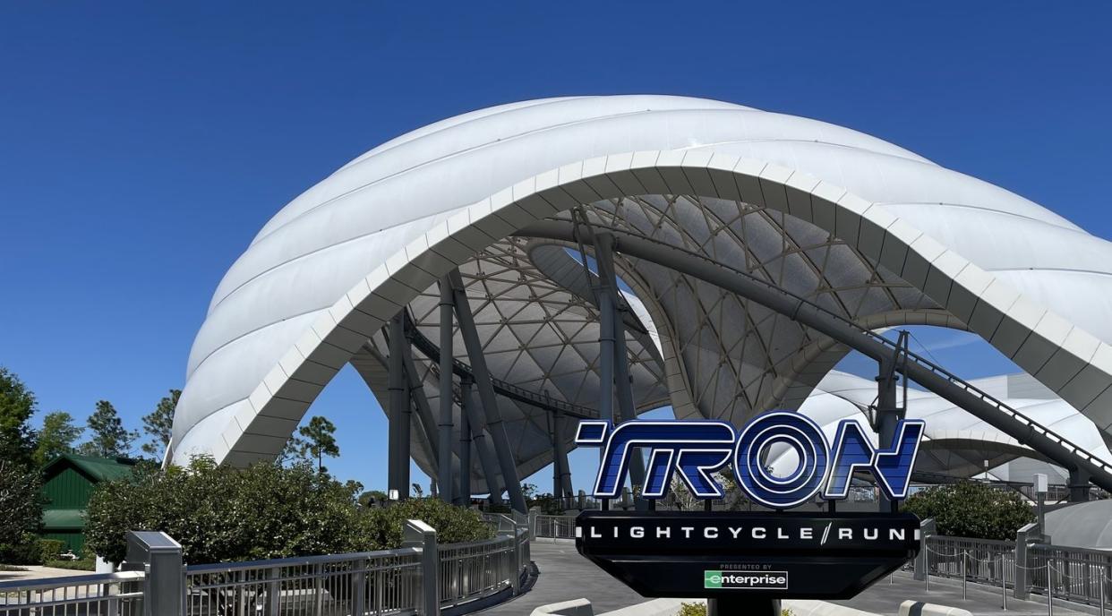 tron light cycle run at walt disney world ride sign and outdoor view