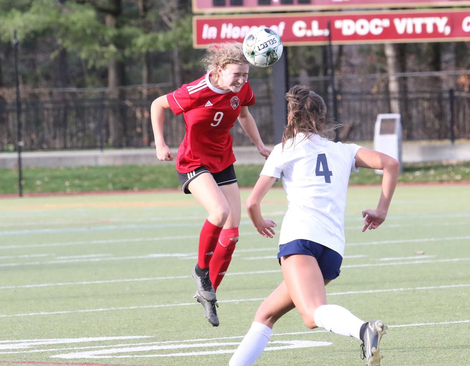 CVU's Stella Dooley heads the ball during the Redhawks' 1-0 win over MMU in the 2022 D1 State Championship at Norwich University.
