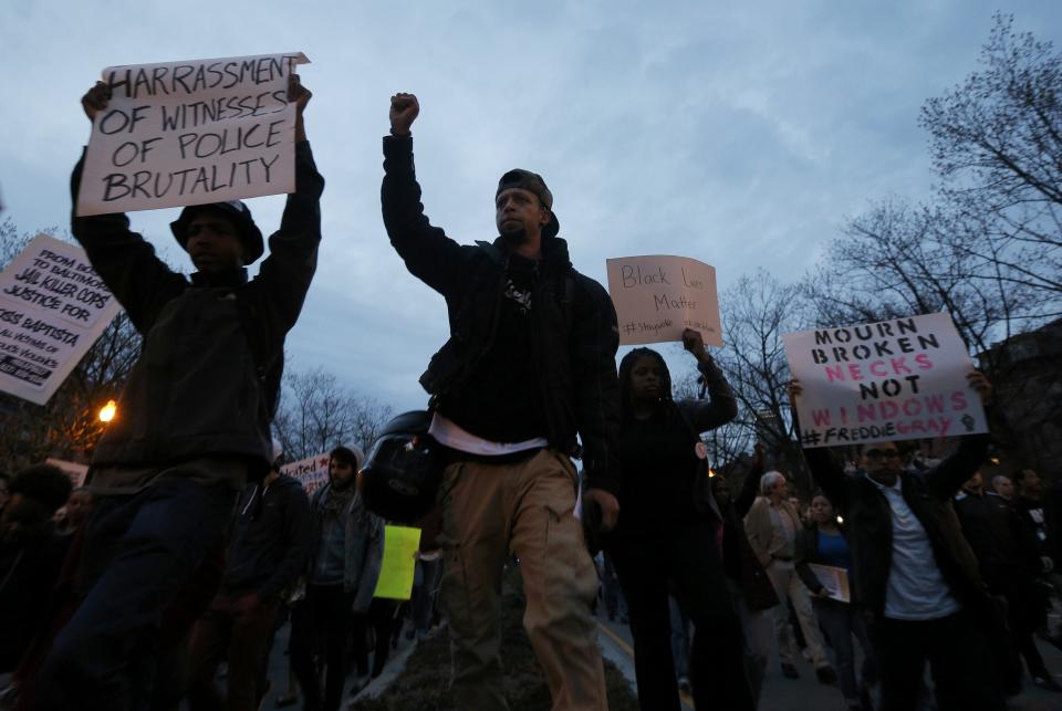 People march in protest against police violence in Boston, Massachusetts April 29, 2015. Protesters marched against police violence in cities from New York to Boston on Wednesday, as troops stood by in Baltimore to enforce a curfew imposed after civil unrest over the death of a 25-year-old black man. (REUTERS/Brian Snyder)
