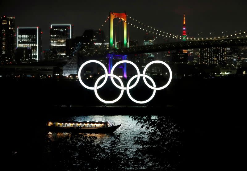 FILE PHOTO: The Rainbow Bridge and Tokyo Tower are illuminated with Olympic colours to mark 100 days countdown to the Tokyo 2020 Olympics in Tokyo