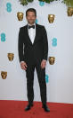 <p>Wearing a traditional tux. <em>[Photo: Getty]</em> </p>