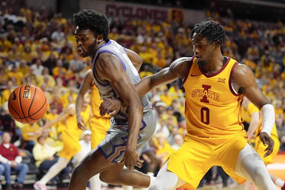 TCU center Ernest Udeh Jr. (8) fights for a loose ball with Iowa State forward Tre King (0) during the first half of an NCAA college basketball game, Saturday, Feb. 10, 2024, in Ames, Iowa. (AP Photo/Charlie Neibergall)