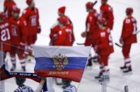 Ice Hockey - Pyeongchang 2018 Winter Olympics - Men's Quarterfinal Match - Olympic Athletes from Russia v Norway - Gangneung Hockey Centre, Gangneung, South Korea - February 21, 2018 - Fans wave Russian flags after the game. REUTERS/Brian Snyder