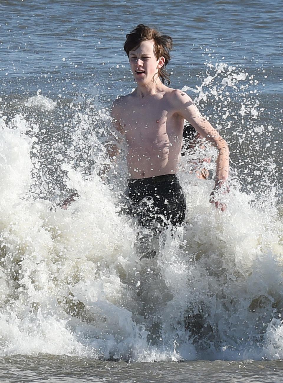 Almost 200 people braved the 40 degree air temperatures and 45 degree water temp to plunge into the Atlantic Ocean in Dewey Beach at the 9th Annual Dewey Dunk on Wednesday, Jan. 1, 2020,  at Dagsworthy Street.