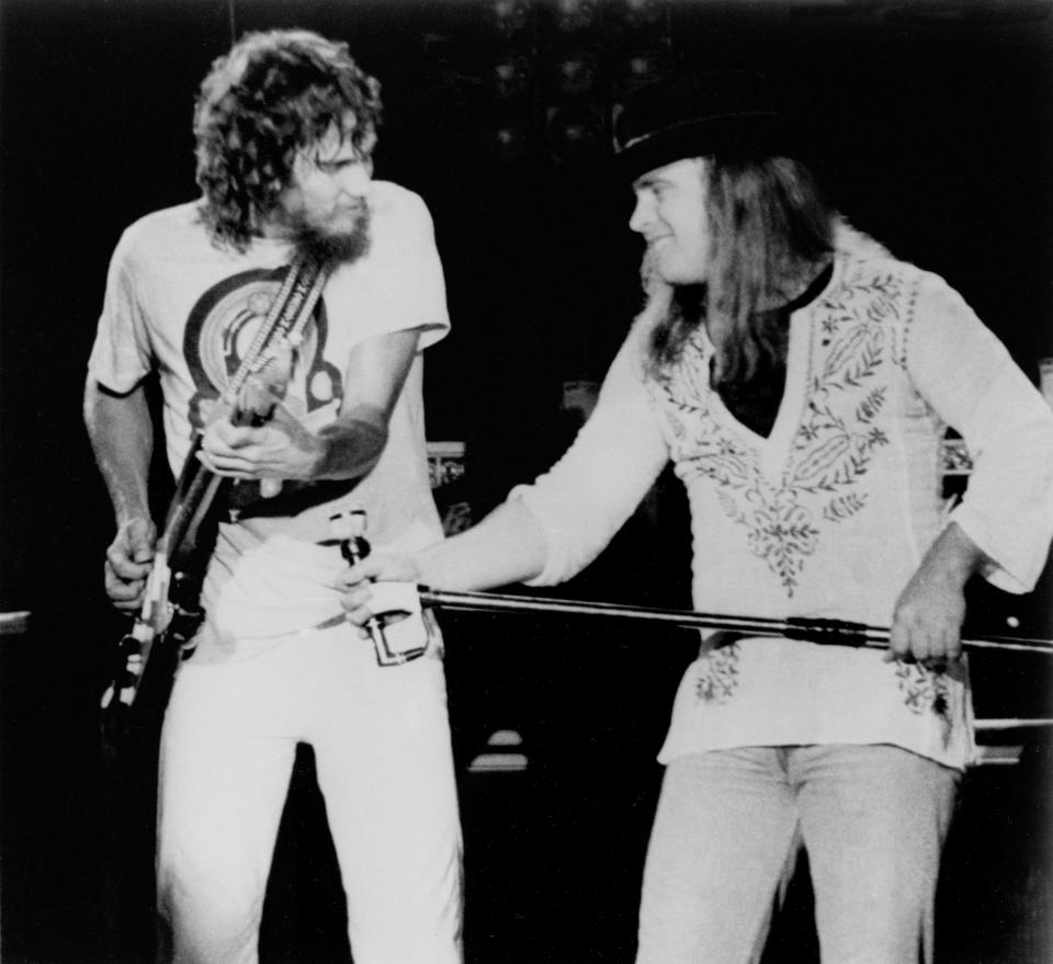 Lynyrd Skynyrd Lead singer Ronnie Van Zant (right) urges on guitarist Steve Gaines during a performance at Convention Hall in Asbury Park, New Jersey July 20, 1977. (AP Photo/JLS)