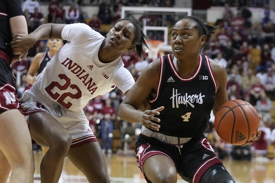 Nebraska's Sam Haiby (4) goes to the basket against Indiana's Chloe Moore-McNeil (22) during the first half of an NCAA college basketball game, Sunday, Jan. 1, 2023, in Bloomington, Ind. (AP Photo/Darron Cummings)