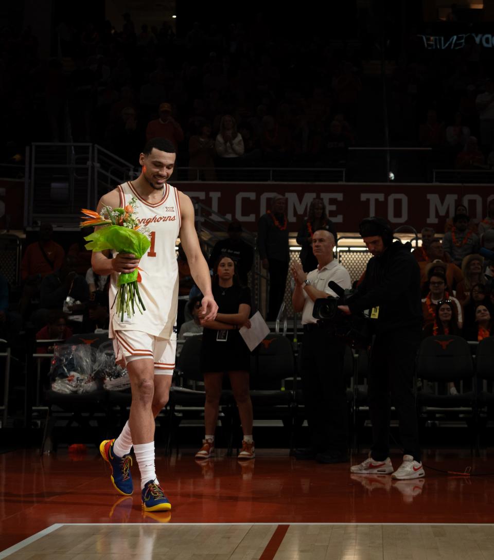 Texas forward Dylan Disu walks onto the court at Moody Center during the Longhorns' Senior Day celebration ahead of the Oklahoma game last weekend. It was the final game at Moody Center for Texas' four seniors, three of whom got to Austin via the transfer portal.