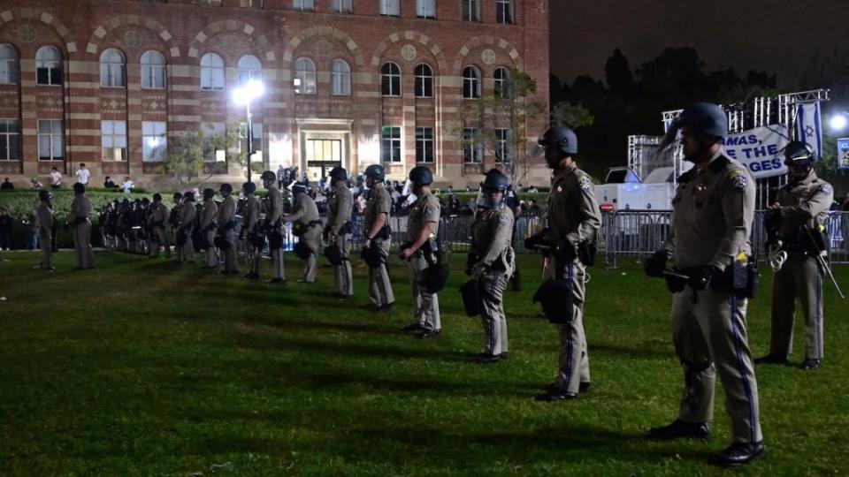 Police stand guard after clashes erupted on UCLA campus April 30