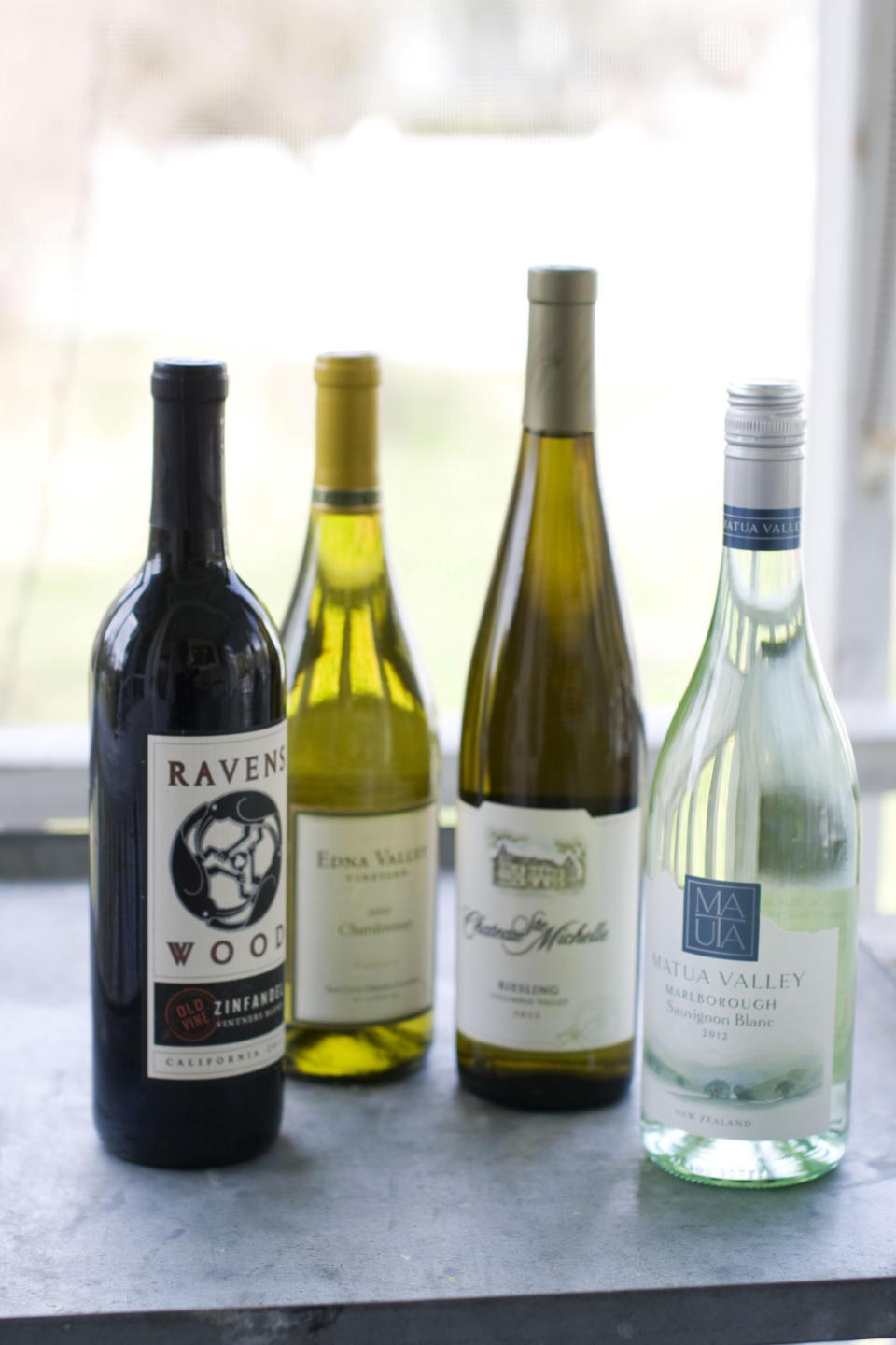This image taken on April 29, 2013 shows, from left, Ravenswood Zinfandel, Edna Valley Chardonnay, Chateau St. Michelle Eroica Riesling and Matua Valley Sauvignon Blanc wines in Concord, N.H. (AP Photo/Matthew Mead)