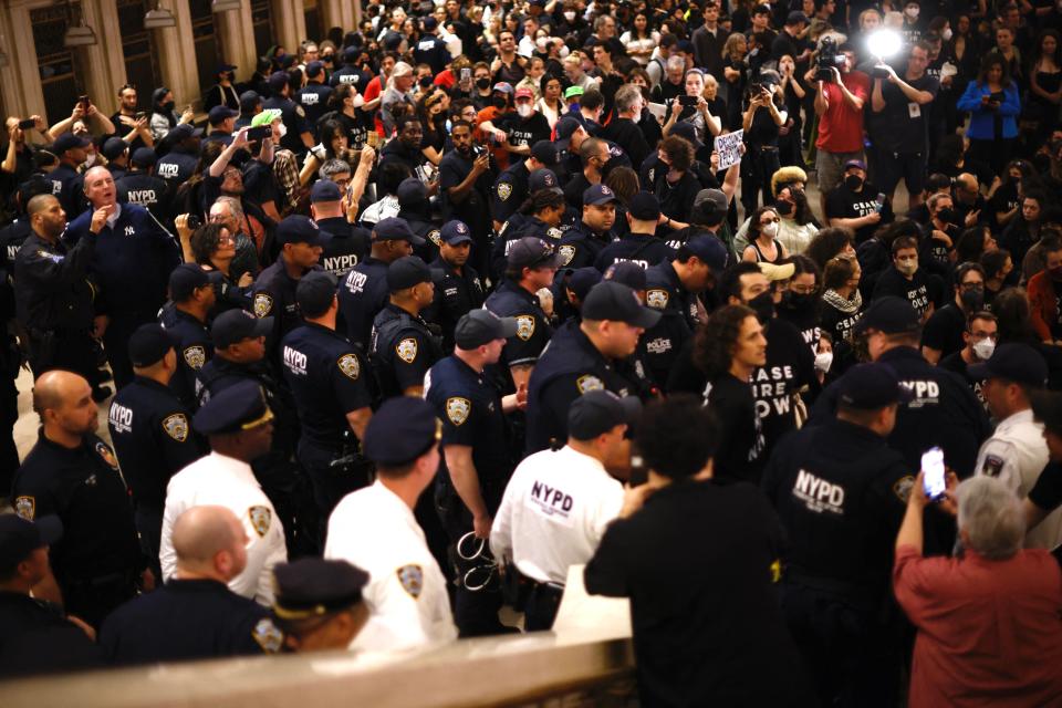 NYPD officers respond as people demonstrate calling for a cease-fire amid war between Israel and Hamas, at Grand Central Station in New York City (AFP via Getty Images)