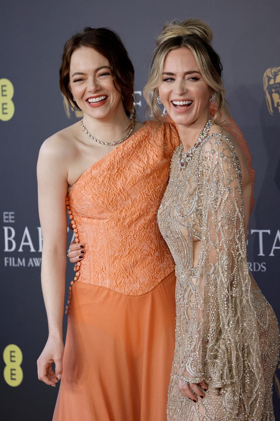Emma Stone, left, and Emily Blunt attend the BAFTA Film Awards 2024.