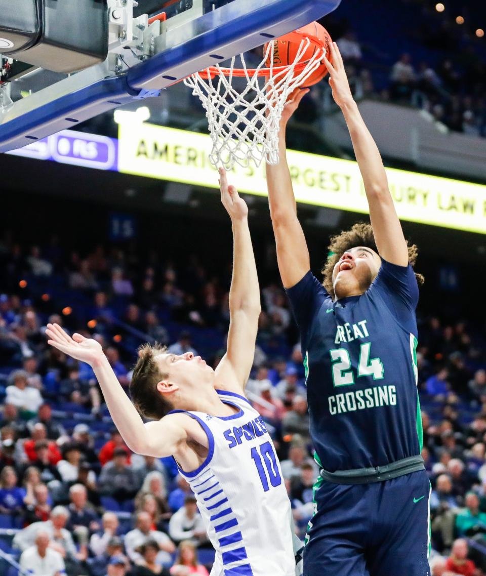 Spencer County's Keaton Baird (10) looks on as Great Crossing's Malachi Moreno (24) scores two in the first round of the 2024 UK Healthcare KHSAA Boys' Sweet 16 in Lexington. March 20, 2024