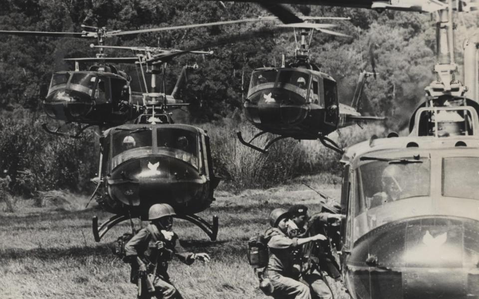 Vietnamese soldiers being picked up by an American Army turbo-jet helicopters after completing an operation against Communist guerillas in a mountamous jungle area of South Vietnam. - AP