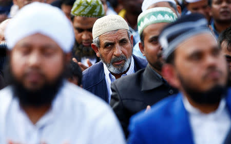 Muslims hold Friday prayers in front of the Colosseum in Rome, Italy October 21, 2016, to protest against the closure of unlicensed mosques. REUTERS/Tony Gentile