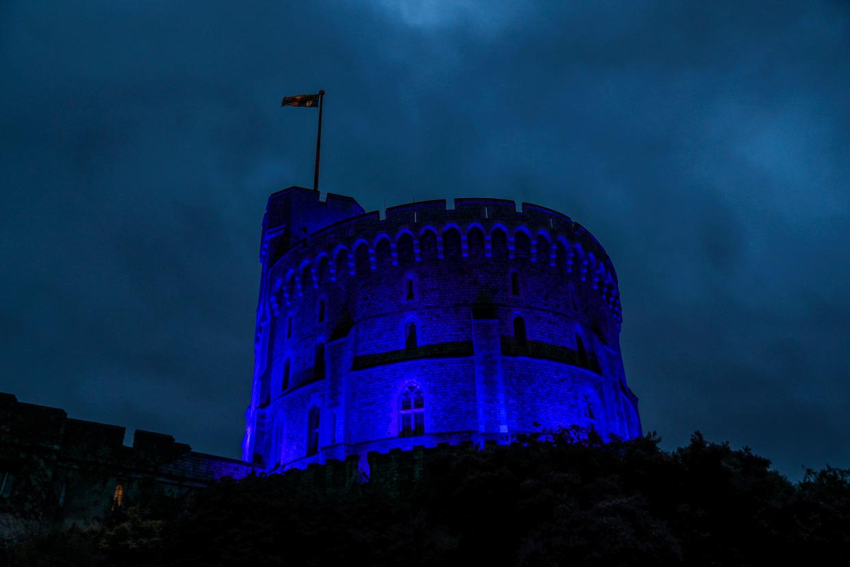 Windsor Castle was illuminated with blue light to mark the 72nd anniversary of NHS on July 5. (Photo: Steve Parsons / POOL / AFP) (Photo by STEVE PARSONS/POOL/AFP via Getty Images)