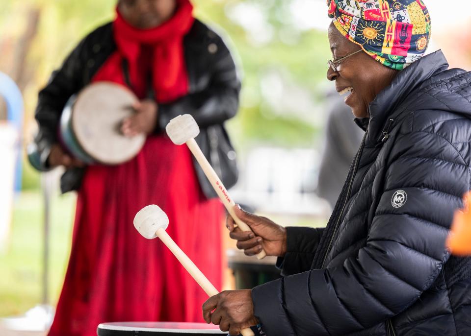 Sabina Santana leads a drum circle at a neighborhood block party held at Frank Young Park in Indianapolis. Santana is the founder of Shifting Ideas Through Education for African Women, Inc., a nonprofit that helps empower and provide educational opportunities to vulnerable girls in rural Uganda and Kenya.
