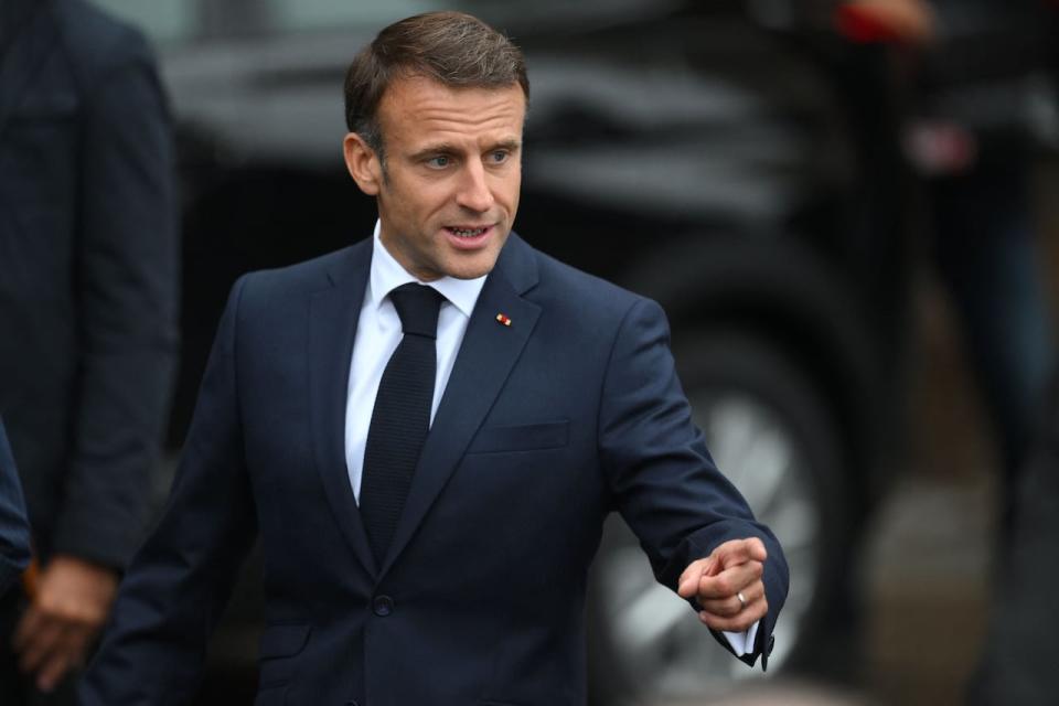 French President Emmanuel Macron gestures after a visit of the Notre-Dame de Paris Cathedral, currently under restoration following a 2019 fire that destroyed its roof, in Paris on September 21, 2023. Britain's King Charles III and his wife Queen Camilla are on a three-day state visit starting on September 20, 2023, to Paris and Bordeaux, six months after rioting and strikes forced the last-minute postponement of his first state visit as king. (Photo by Daniel LEAL / AFP) (Photo by DANIEL LEAL/AFP via Getty Images)