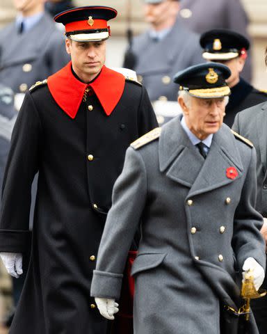 <p>Samir Hussein/WireImage</p> Prince William and King Charles during the National Service of Remembrance at The Cenotaph on November 12, 2023 in London.