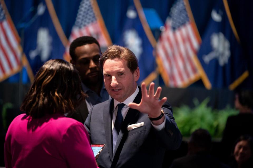 PHOTO: Democratic challenger U.S. Rep. Dean Phillips talks with people during the South Carolina Democratic Party First in the Nation Celebration and dinner at the state fairgrounds on Jan. 27, 2024 in Columbia, South Carolina.  (Sean Rayford/Getty Images)