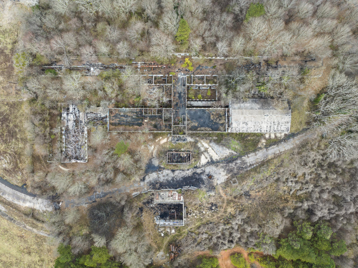 In this aerial view, a structure sits on land owned by the city of Atlanta, Thursday, Jan. 26, 2023, in unincorporated DeKalb County. The Atlanta City Council has approved plans to lease the land to the Atlanta Police Foundation so it can build a state-of-the-art police and firefighter training center, a project that protesters derisively call “Cop City.” (AP Photo/Danny Karnik)