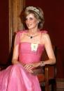 <p>Princess Diana, here at a state reception in Australia in 1983, received a suite of sapphire jewels from the Saudi royal family as a wedding gift, which included a very large Burmese sapphire pendant set on a thin diamond necklace and surrounded by baguette diamonds, matching earrings, a ring (not pictured), a double-row diamond bracelet with a sapphire centerpiece, and a watch featuring seven sapphires (also not pictured).</p>