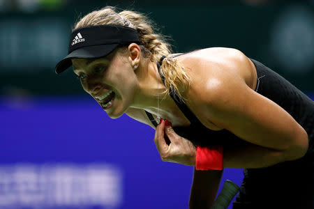 Tennis - WTA Tour Finals - Singapore Indoor Stadium, Kallang, Singapore - October 22, 2018 Germany's Angelique Kerber reacts during her group stage match against Kiki Bertens of the Netherlands REUTERS/Edgar Su