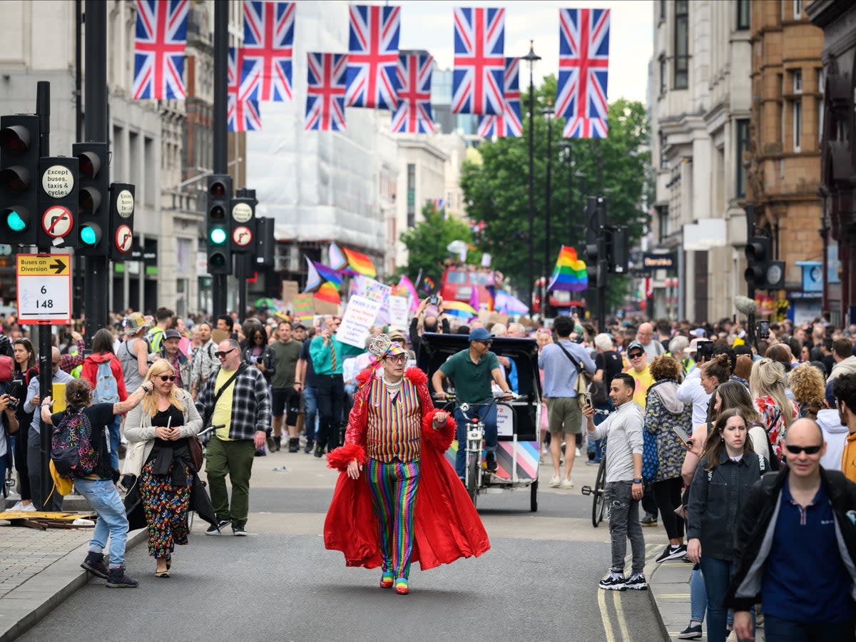 Gay rights activists march along Oxford Street during an event to mark fifty years since the first UK Pride March at Trafalgar Square (Getty Images)
