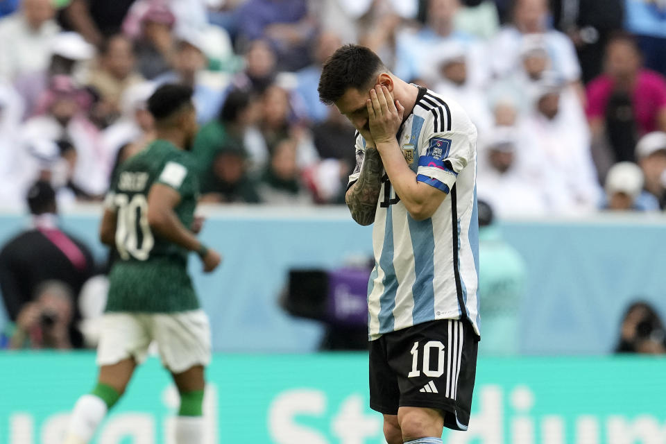 FILE - Argentina's Lionel Messi reacts disappointed during the World Cup group C soccer match between Argentina and Saudi Arabia at the Lusail Stadium in Lusail, Qatar, on Nov. 22, 2022. For a brief moment after Saudi Arabia's Salem Aldawsari fired a soccer ball from just inside the penalty box into the back of the net to seal a win against Argentina, Arabs across the divided Middle East found something to celebrate. (AP Photo/Natacha Pisarenko, File)