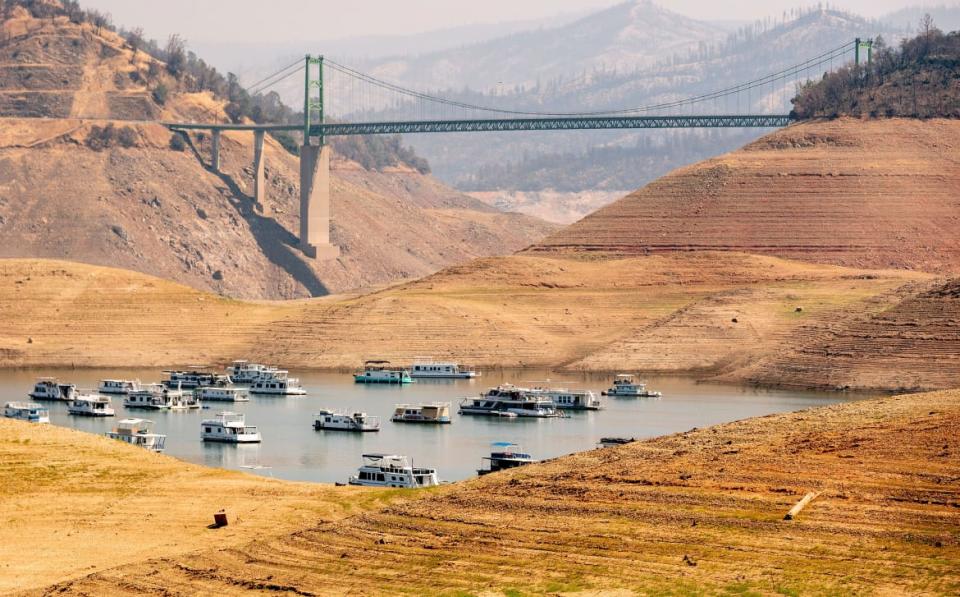 <div class="inline-image__caption"><p>Houseboats in a narrow section of water in depleted Lake Oroville in Oroville, California, on Sept. 5, 2021. </p></div> <div class="inline-image__credit">Josh Edelson/AFP via Getty Images</div>