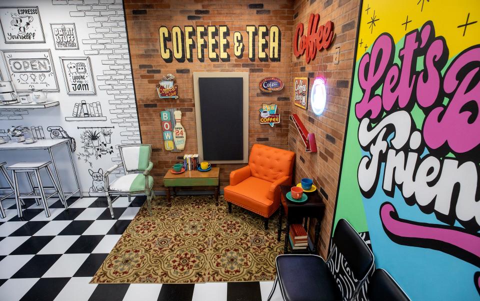 Travis Settineri and his wife Amber, decorated the headquarters of the Worth and Purpose ministry in Lakeland. The space on West Main Street includes a barber room, a replica of a 1950s diner, an arcade area and a whimsically appointed cafe.