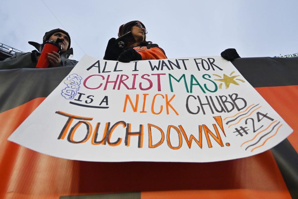 Browns fans hold a sign in support of running back Nick Chubb before a game against the Ravens, Dec. 17, 2022, in Cleveland.