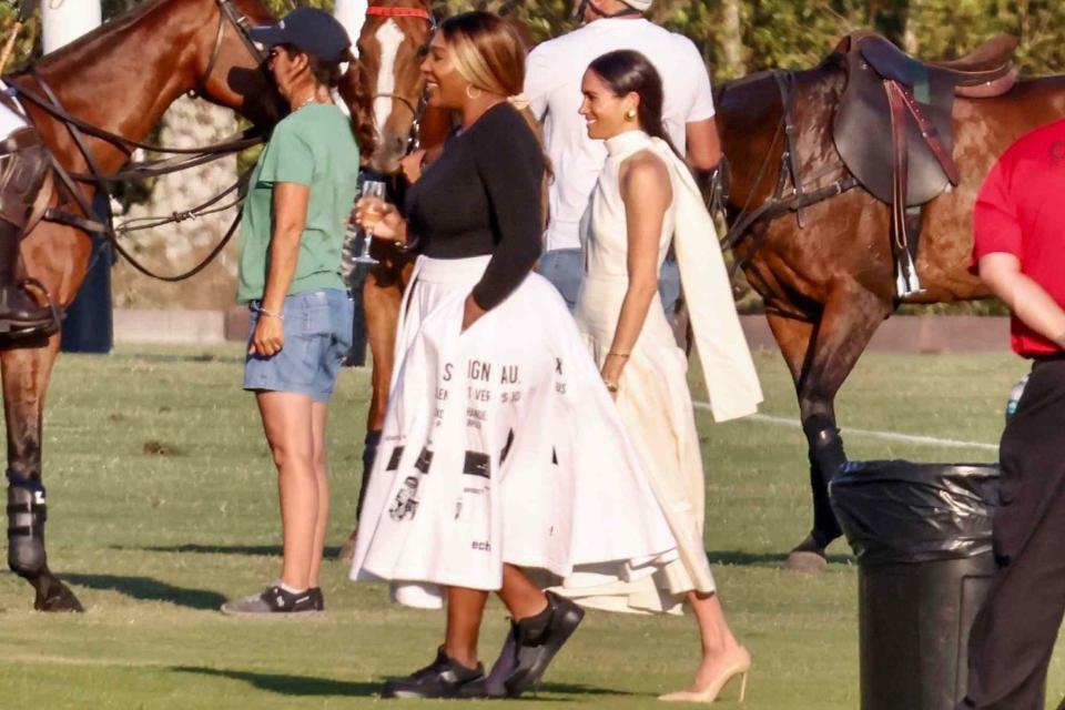 <p>BACKGRID </p> Meghan Markle and Serena Williams spend time together at the Royal Salute Polo Challenge in Florida on April 12