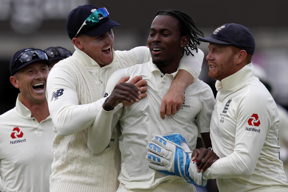 England's Jofra Archer (2R) celebrates taking the wicket of Australia's David Warner (unseen) for five runs during play on the fifth day of the second Ashes cricket Test match between England and Australia at Lord's Cricket Ground in London on August 18, 2019. (Photo by Adrian DENNIS / AFP) / RESTRICTED TO EDITORIAL USE. NO ASSOCIATION WITH DIRECT COMPETITOR OF SPONSOR, PARTNER, OR SUPPLIER OF THE ECB        (Photo credit should read ADRIAN DENNIS/AFP/Getty Images)