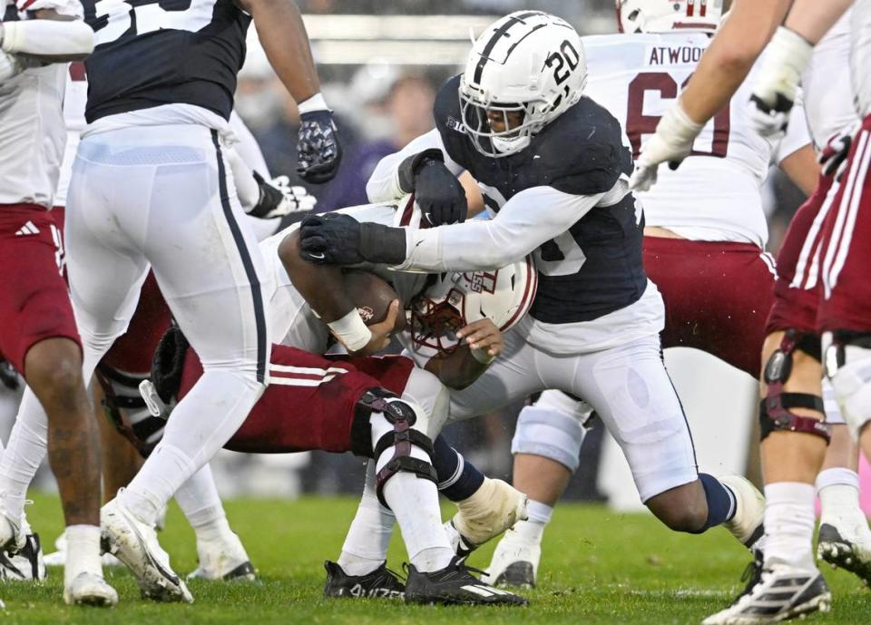 Penn State defensive end Adisa Isaac stops UMass quarterback Taisun Phommachanh during the game on Saturday, Oct. 14, 2023. Abby Drey/adrey@centredaily.com