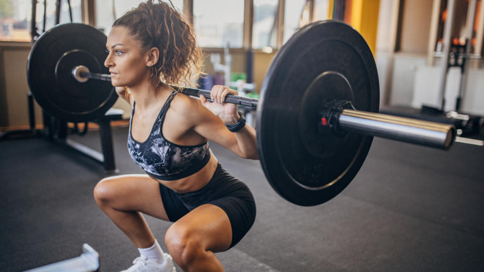 Woman performing a weighted squat