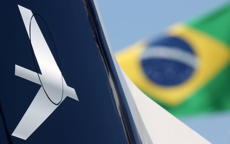 The Embraer logo is seen during the LABACE fair in Sao Paulo