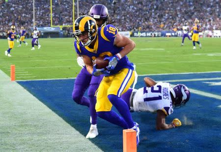 Sep 27, 2018; Los Angeles, CA, USA; Los Angeles Rams wide receiver Cooper Kupp (18) catches touch down pass in the end zone in the second quarter against the Minnesota Vikings at the Los Angeles Memorial Coliseum. Mandatory Credit: Jayne Kamin-Oncea-USA TODAY Sports