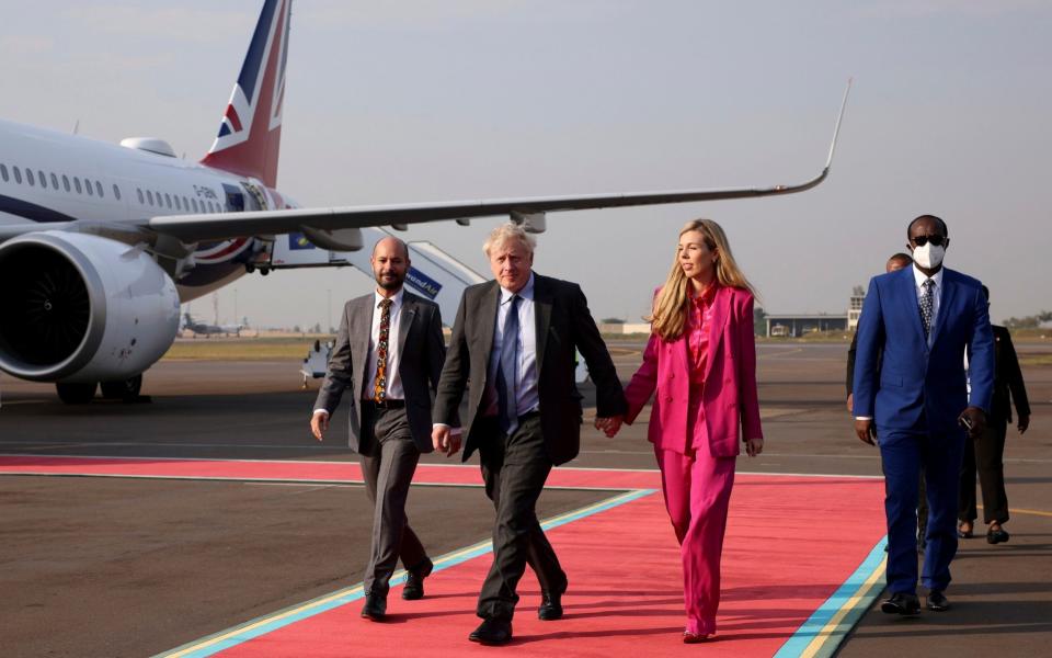 Boris Johnson and his wife Carrie are pictured in Kigali, Rwanda this morning  - Dan Kitwood/Getty