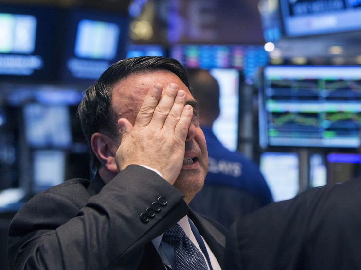 An NYSE official gestures after the resumption of trading following a several hour long stoppage on the floor of the New York Stock Exchange, July 8, 2015. REUTERS/Lucas Jackson 