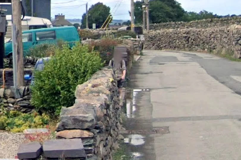 The young man walking along Henbarc Road, Bethesda, Gwynedd